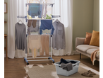 W5 3 Tier Clothes Airer with various clothes drying in a bright room.
