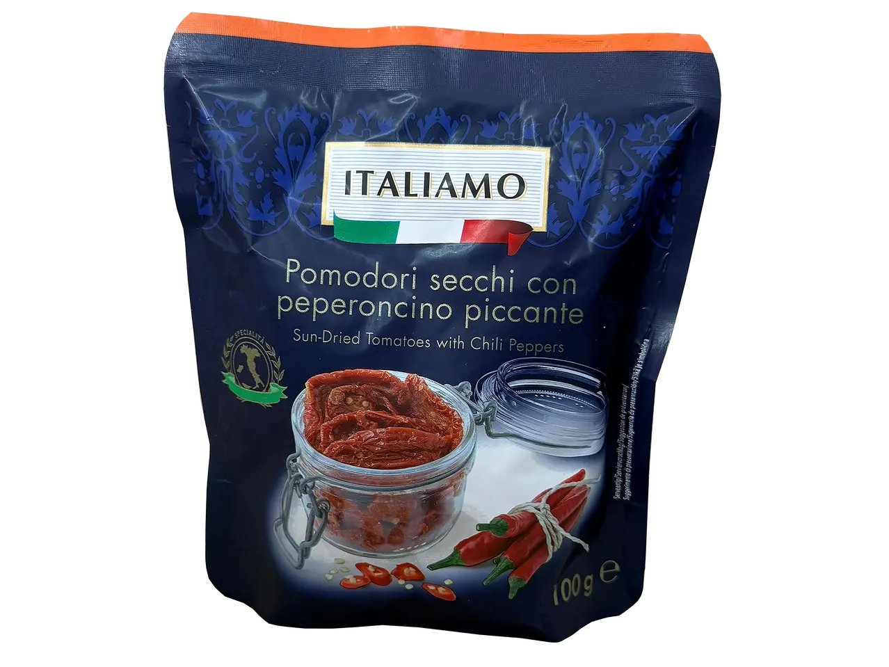 Sachet de tomates séchées au piment, avec un pot en verre et des piments frais, 100g.