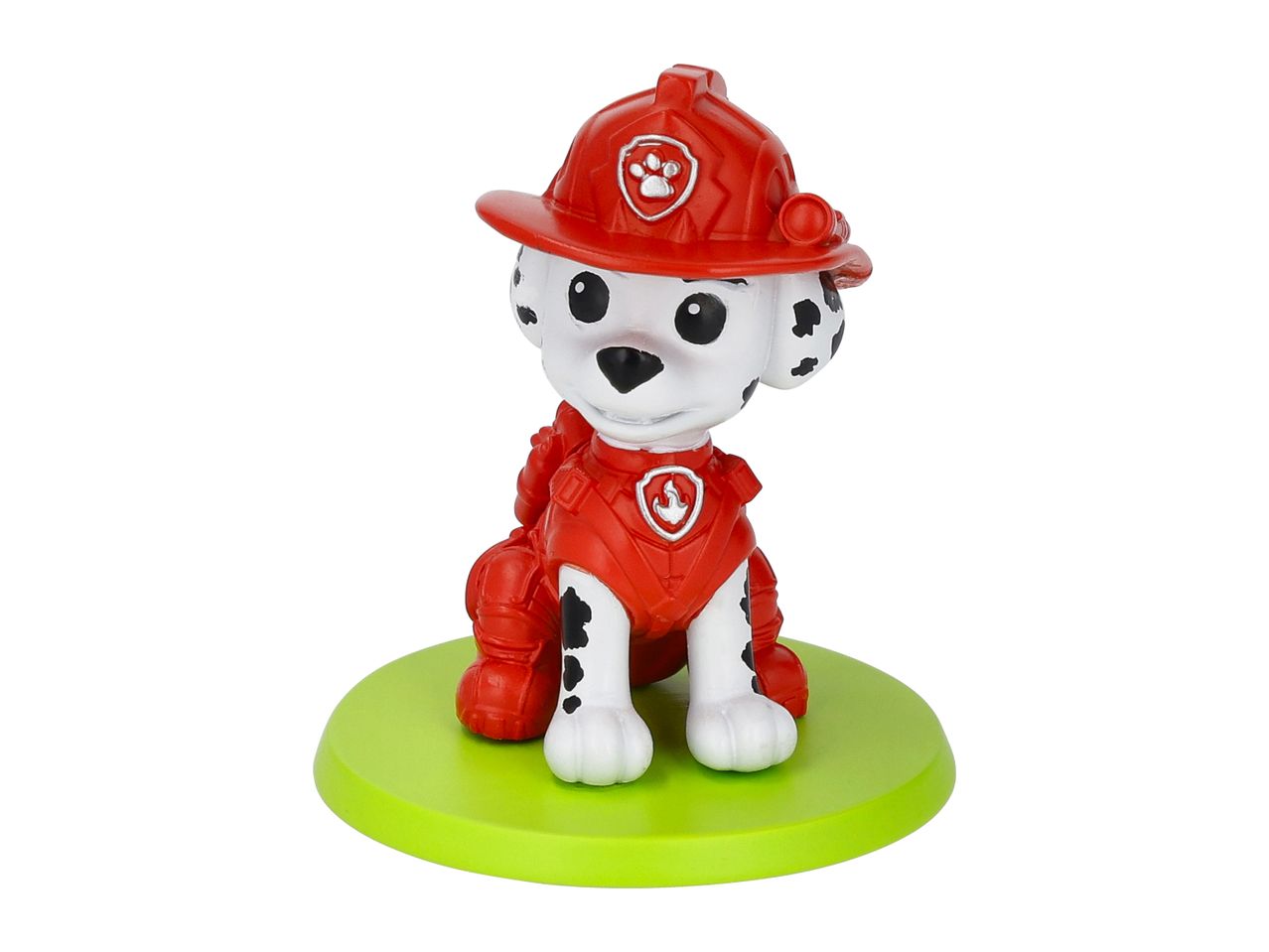 A white dog figurine with black spots, wearing a red firefighter helmet and uniform, on a green base.