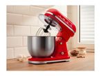 Red stand mixer with a stainless steel bowl on a kitchen counter