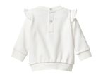 White long-sleeved baby top with ruffle shoulders and snap buttons on the back.