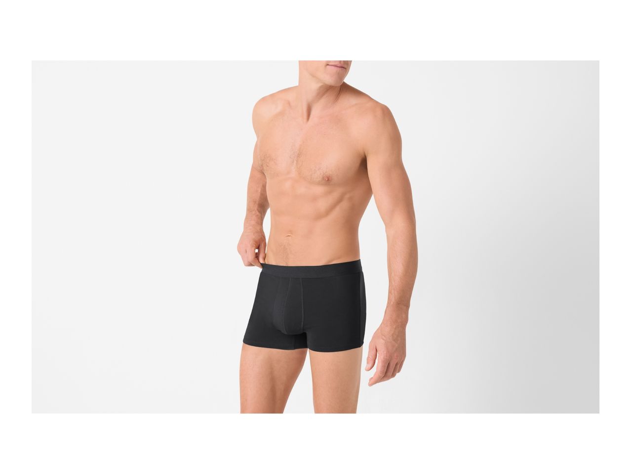 Torso of a man wearing black boxer briefs