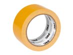 A roll of 3M double-sided tape with visible branding on the core.