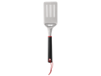 Stainless steel grill spatula with ergonomic handle.