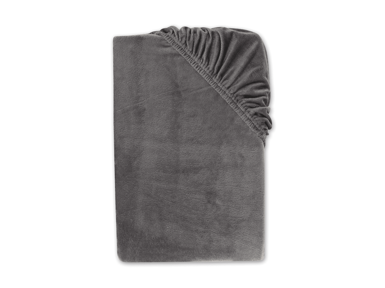 Graues Spannbettlaken aus weichem Stoff, ordentlich gefaltet