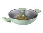 Light green wok with a glass lid, filled with colorful vegetables like asparagus and bell peppers.