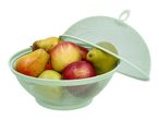 A light green mesh fruit bowl with a lid, filled with apples and pears.
