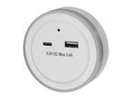 White circular USB charger with USB-A and USB-C ports.