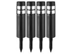 Four black solar-powered garden lights with clear, gridded tops and ground stakes.