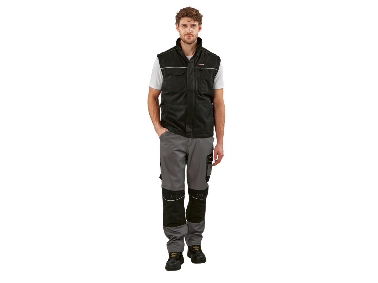 A man wearing a black PARKSIDE PERFORMANCE® work gilet, white t-shirt, and grey work trousers.