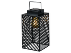 Black metal lantern with diagonal cutouts and a glowing bulb inside