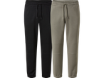 Två par mörka och beige joggingbyxor med dragsko i midjan.