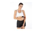 Woman in sports bra and shorts using a massage gun on her arm.