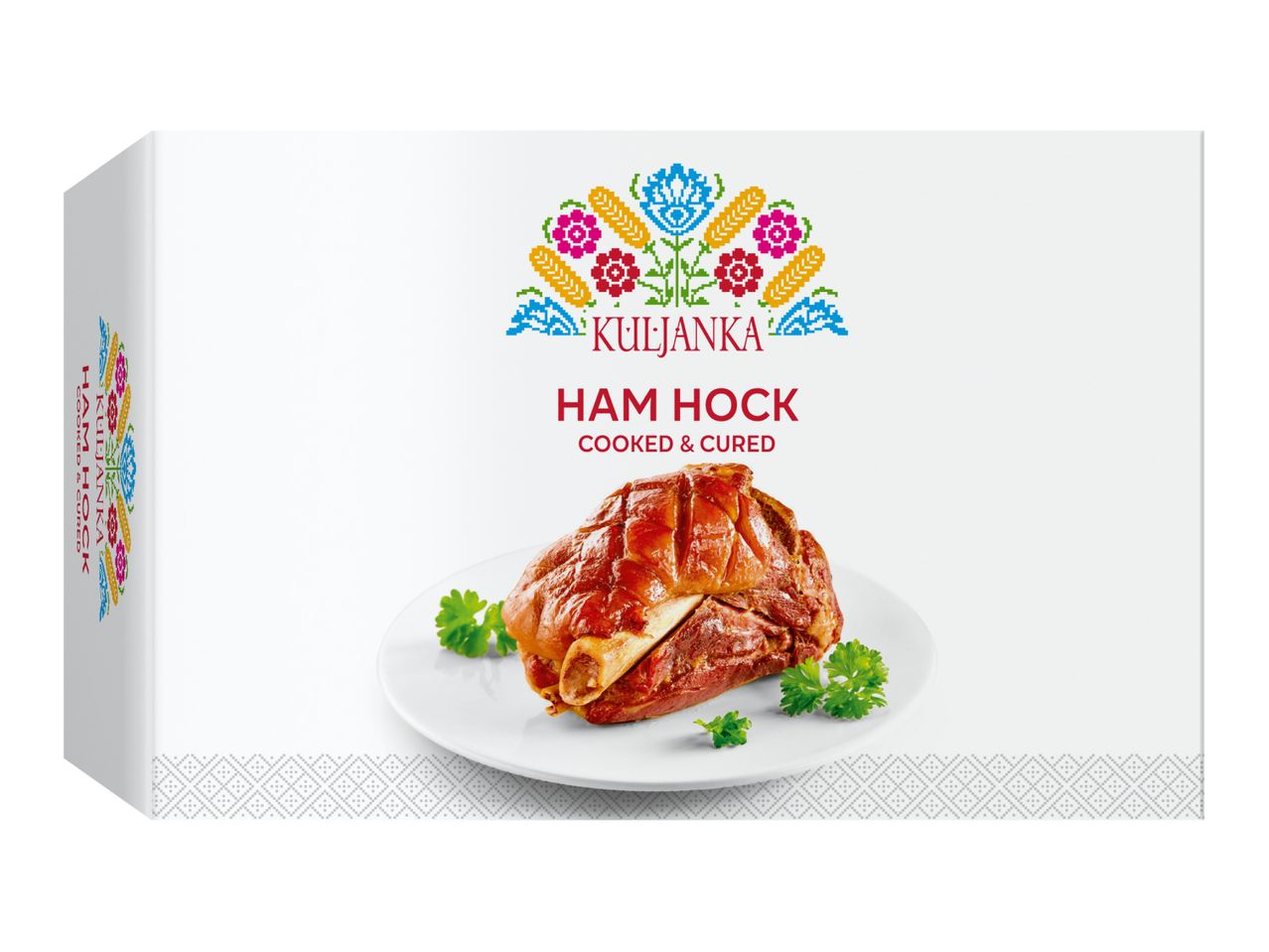 Ham hock, cooked and cured, on a white plate with parsley, in a white box with folk art design.