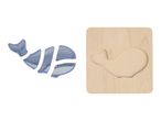 Whale-shaped wooden puzzle with four blue pieces and a wooden board with a whale cutout.