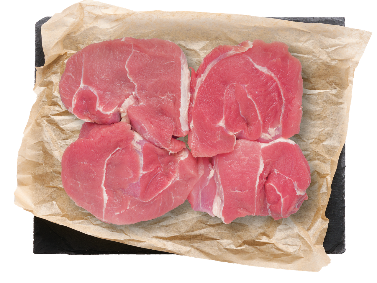 Четири парчета сурово свинско месо върху хартия за печене на черен фон.