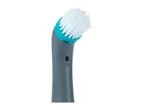 Close-up of a gray and teal handheld cleaning brush with white bristles.