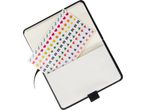 A black notebook with a colorful sticker sheet partially visible.