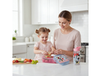Mother and child preparing lunch with Disney Minnie Mouse drink bottle and lunchbox.