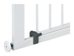 Close-up of a white metal safety gate with a grey plastic locking mechanism