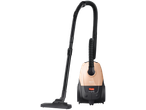 A peach and black vacuum cleaner with a long hose and floor nozzle.