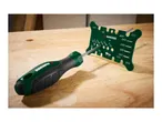 A green and black round file with a green chainsaw sharpening gauge on a wooden workbench.