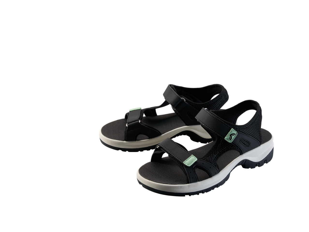 Pair of black and white sports sandals with light green accents.