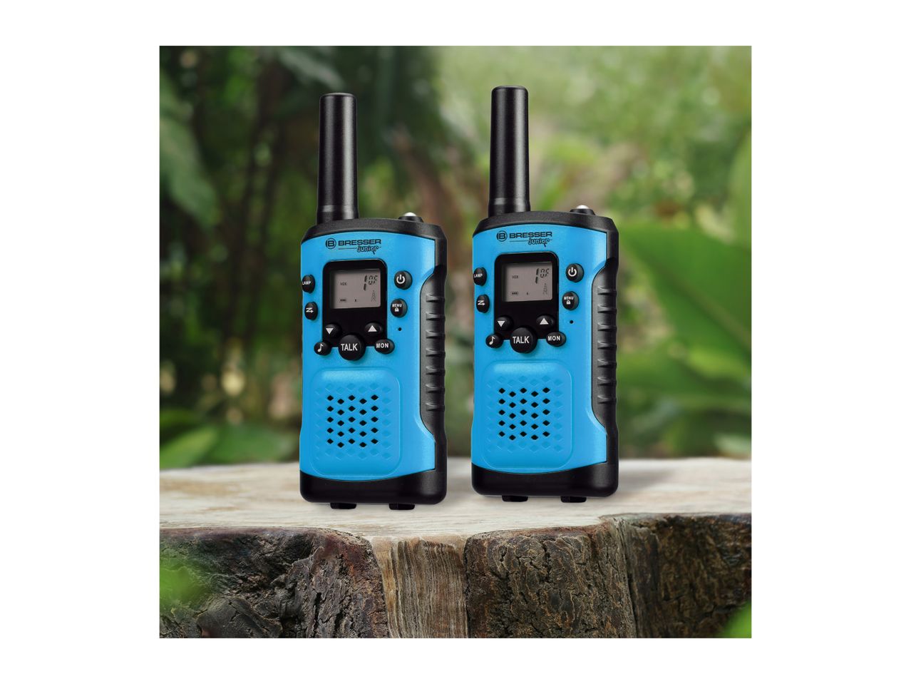 Two blue and black walkie-talkies with screens and buttons, on a wooden surface outdoors.