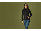 Woman in a black fleece jacket.
