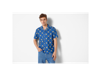 Man wearing a blue Lidl short-sleeve shirt with a repeating logo pattern and jeans.