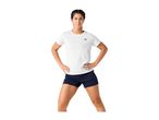 Woman in white short-sleeved sports top and navy blue shorts.