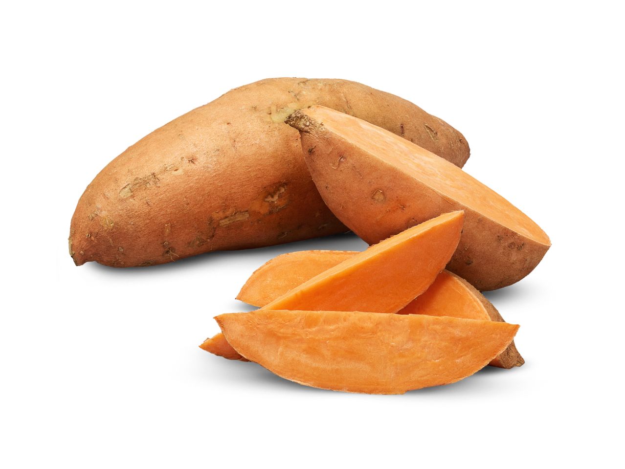 Whole and sliced sweet potatoes with orange flesh on a white background.