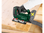 Person using a Parkside jigsaw to cut wood, with a dust extraction hose attached.