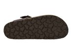 Bottom view of a dark brown sandal with a patterned sole.