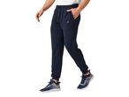Man wearing navy blue joggers and athletic shoes