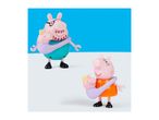 Two pig figures, one with glasses, each carrying a baby pig in a sling.