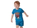 Child wearing a blue Minnie Mouse pajama set.