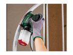 Handheld sander with dust collection box sanding a curved metal bar
