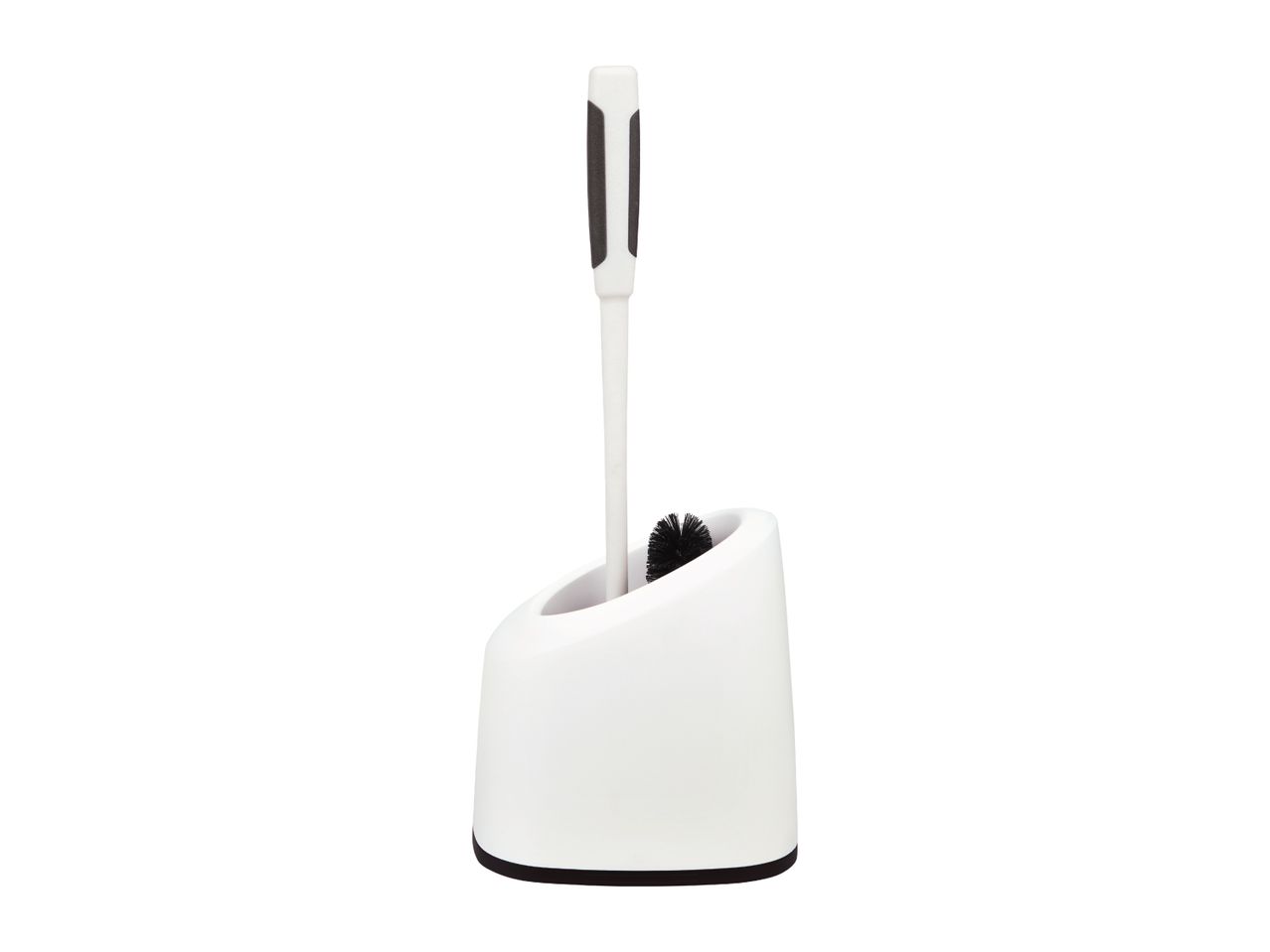 A white toilet brush with a black handle sits in a matching holder.