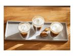 Three glasses of coffee with milk foam and biscotti on a concrete tray.