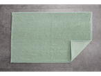 LIVARNO home light green bath mat with a textured surface on a gray tiled floor