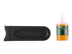 Black chain cleaning brush and a bottle of organic chain oil.