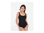 Woman in black ribbed lace-trim camisole and briefs, smiling and looking to the side.