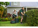 Man using a Parkside® 450W Electric Hedge Trimmer, woman emptying a Parkside® lawnmower bag.