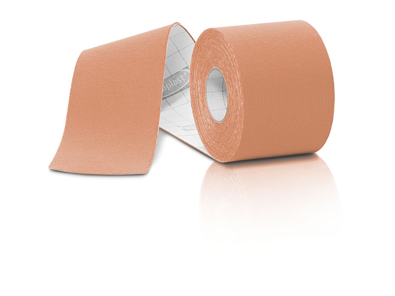 A roll of beige kinesiology tape with a white backing, partially unrolled, on a white surface.