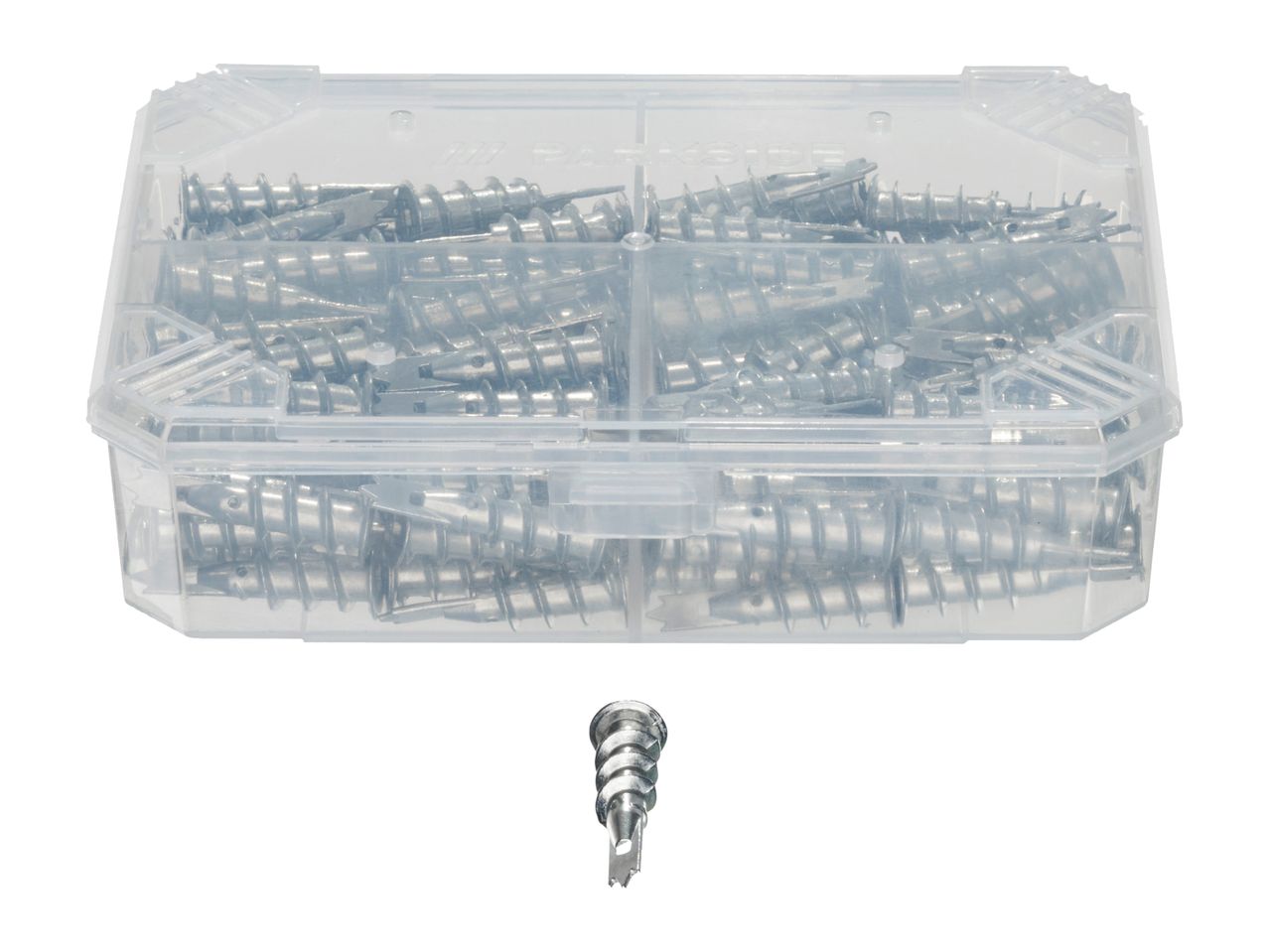 A clear plastic box filled with metal drywall anchors, with one anchor placed below.