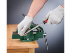 A person uses a file to shape a metal bar held in a vise.