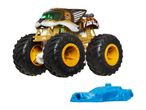 Monster Jam Tiger Shark monster truck toy with a blue launcher.