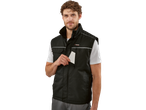 Man wearing a black Parkside work vest, holding a white card.