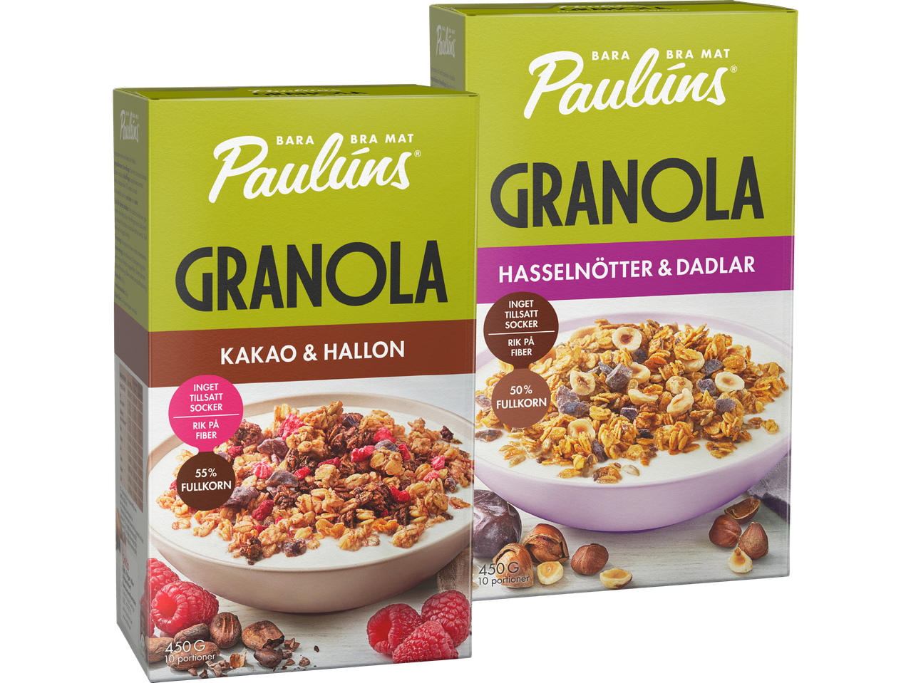 Två förpackningar Paullins granola, en med blåbär och hasselnötter, den andra med hasselnötter och bär.